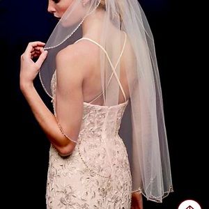 Beaded scalloped trimmed fingertip veil